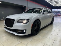 The 2023 Chrysler 300, particularly the 300C RWD in pristine white, is a powerful sedan that truly s... (image 5)