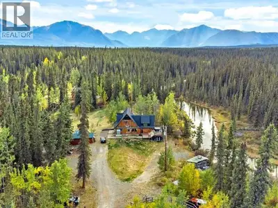 Homestead living just 30 minutes from Whitehorse! Welcome to 125 Old Bridge Road, a 1.84-acre river...