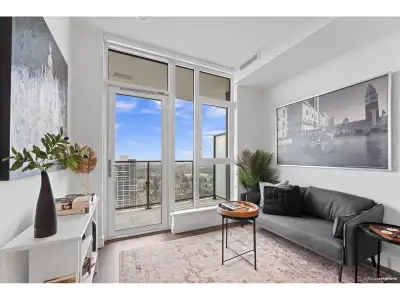 The Grand on King George presents a stunning 1-bedroom + den suite with spectacular views of the mou...