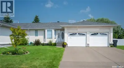 Enjoy the perfect blend of low-maintenance living and the privacy in this beautifully updated bungal...