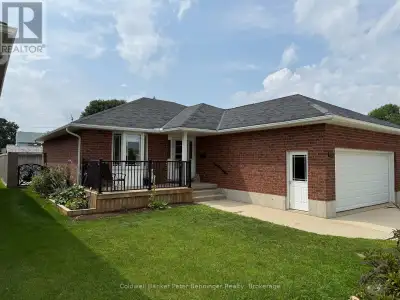 This solid brick bungalow offers 1184 sq ft of comfortable main level living. The bright living room...