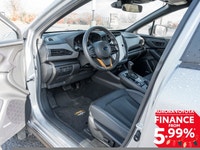 The 2024 Subaru Crosstrek Wilderness AWD in a striking silver finish with an automatic AWD transmiss... (image 9)