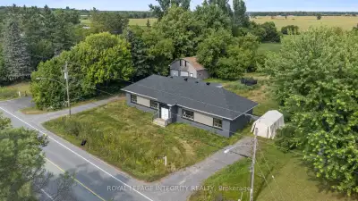 Updated and vacant side-by-side duplex with detached over-sized double car garage & loft sitting on...