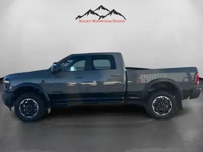 WAS: $110300 NOW: $105300 plus taxes and licensing feesThe 2026 Ram 2500 Rebel in stunning gray is a...