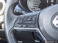 The former daily rental 2024 Nissan Versa SV, dressed in an eye-catching Aspen White TriCoat, presen... (image 9)