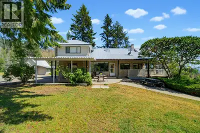 Set on 6.87 picturesque acres with stunning lake views, this timeless farmhouse-style home offers th...