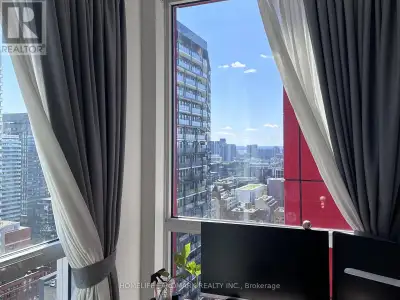 Fully furnished 1+Den at Picasso Condos with stunning south-facing CN Tower and city views from the...