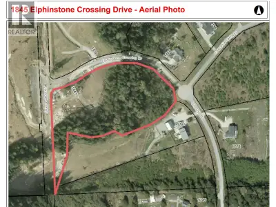Country Estate Acreage in Elphinstone Crossing. Beautiful treed valley views. 6.8 acres of gently sl...