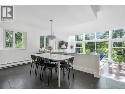 Stunning ground floor, loft style corner unit in Tsawwassen´s favourite building, The Classic. This...
