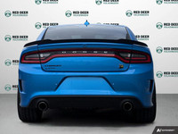 The 2023 Dodge Charger Scat Pack 392 in striking blue with a robust rear-wheel drive offers a dynami... (image 5)