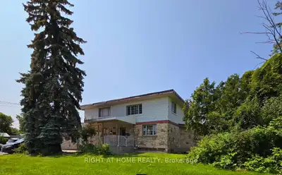 This unique legal Triplex, currently being used by one family, sits on a large 200' x 120' corner lo...