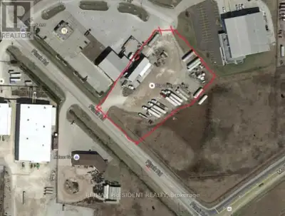 A RARE FIND 1.89 Acre Lot with 2 Entrances (Front & Back) and Drive-Through Shop/Bay. CALLING ALL TR...