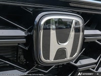 The 2026 Honda CR-V Hybrid EX-L in a stunning Blue finish with AWD handling offers an optimal drivin... (image 8)