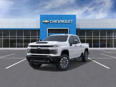 The 2026 Chevrolet Silverado 2500HD Custom in elegant white offers a robust 44 drivetrain, ensuring...