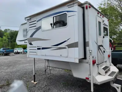 2010 Adventurer 86SBS truck camper (8ft 6") featuring a slide-out with a queen-size bed (new mattres...