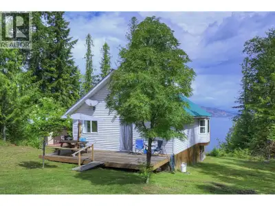 Waterfront home at the desirable Quesnel Lake junction with gorgeous beach, shallow bank & spectacul...