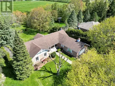 Imagine this incredible view 365 days a year! Daily sunsets! Situated on a rare 1-acre lot, this cus...