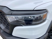This *2025 Ram 1500 Rebel Crew Cab 4x4* in *Bright White* represents the newest chapter of Ram perfo... (image 8)