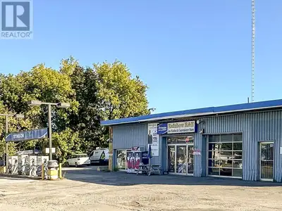 1592 sq ft total. 1134 sq. ft. office space and a with a 458 sq ft bay for workshop/storage/indoor p...