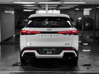 Elevate your driving experience in the sophisticated 2025 INFINITI QX60 Pure, finished in striking G... (image 4)