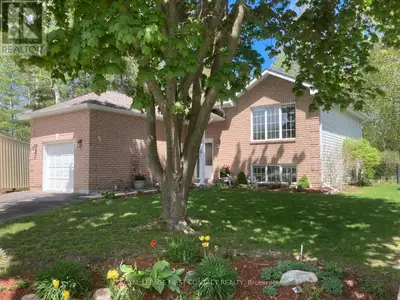 Welcome to this bright and beautiful raised bungalow located on a 63 x 122 irregular lot nestled on...
