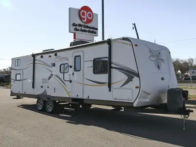 The 2014 Spree 324BH is a spacious, family-focused travel trailer built for comfort on extended trip...