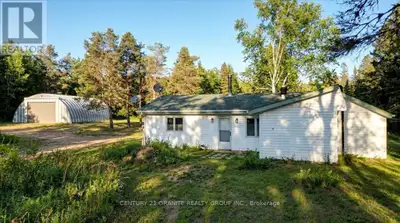 45 Acres of Privacy, Trails, Pond & a Massive Quonset Hut - Just Minutes from Bancroft! If you've be...