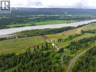 Rare Fraser River waterfront farmstead on 37 acres of productive Class 1 benchland in a sunny Caribo...