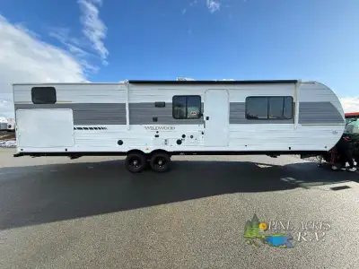 Forest River Wildwood travel trailer 33TS highlights: Private Bunkhouse Versa Queen Bed Custom King...