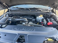 This 2021 Ram 1500 Sport Crew Cab, striking in Granite Crystal Metallic, stands ready for action, bo... (image 9)