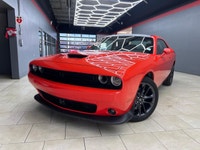 Meet the 2022 Dodge Challenger GT in a vibrant orange finish, gracefully combined with an AWD drivet... (image 3)