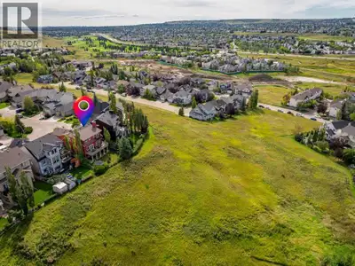 Welcome to 122 Hidden Creek Heights, a beautifully crafted, custom-built home backing onto the pictu...