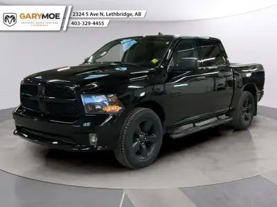 Experience the power and versatility of the 2021 Ram 1500 Classic Express, draped in a striking blac...