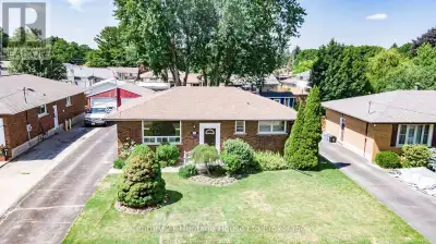 Welcome to 1009 Warwick Street. This charming all-brick bungalow is settled in a mature Woodstock ne...