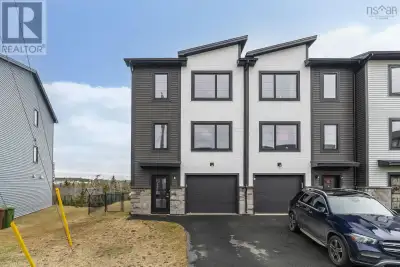 This beautifully designed end-unit townhouse, just three years young, offers contemporary living pai...
