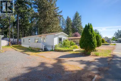 55+ community mobile home being sold as-is, offering a bright and easy layout with a spacious kitche...