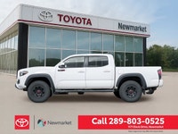 The 2019 Toyota Tacoma TRD Off Road 4x4 Double Cab V6 in a stunning white color with a robust 4x4 dr... (image 2)