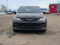 The 2026 Chrysler Grand Caravan SXT in Diamond Black Crystal Pearl with a Black interior combines fa... (image 9)