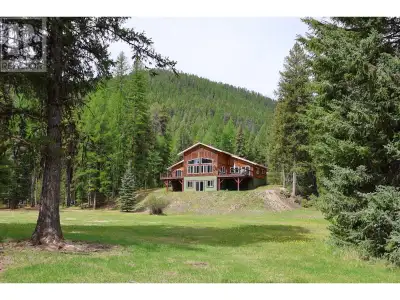 Rare opportunity to own an extremely private un-zoned, off grid 40.28 ac property and custom home, w...