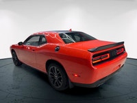 Meet the 2022 Dodge Challenger GT in a vibrant orange finish, gracefully combined with an AWD drivet... (image 5)