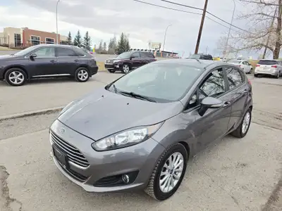 Zoomer Auto Text/Call for Viewing 403-615-5797 Navigation, Sunroof, Bluetooth 2014 Ford Fiesta Hatch...