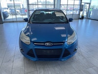 The 2014 Ford Focus SE is a fuel-efficient and compact sedan that's perfect for daily commuting and... (image 6)