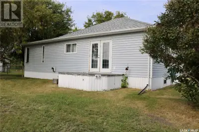 A fantastic property with 5 lots, totalling 130'x 130'. Fenced yard, 32 x 30 insulated double garage...