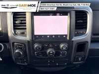 The 2022 Ram 1500 Classic SLT 4x4 Crew Cab stands out with its sophisticated gray exterior and power... (image 6)