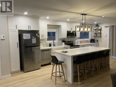 Welcome to your new life in this stunning waterfront dream home. Custom designed and newly built as...