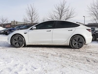 Experience the epitome of modern driving with the 2023 Tesla Model 3 Long Range AWD in a stunning Wh... (image 4)