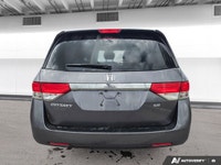 Experience the comfort and practicality of this pre-owned minivan, finished in elegant Alabaster Gre... (image 3)