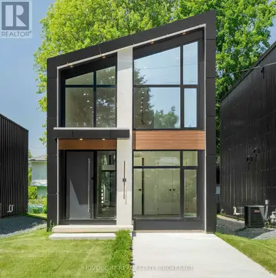 Move right into this newly built contemporary home just a short walk to the sandy beaches of Lake Er...