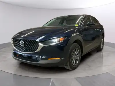 The 2025 Mazda CX-30 GX AWD in a stunning blue offers a smooth automatic transmission combined with...