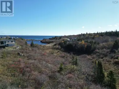 Discover tranquility on this stunning 3-acre parcel overlooking a picturesque cove with sweeping oce...